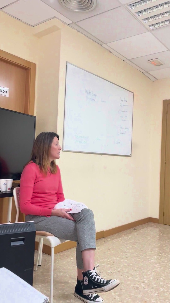 A student in the Spanish school classroom by the whiteboard